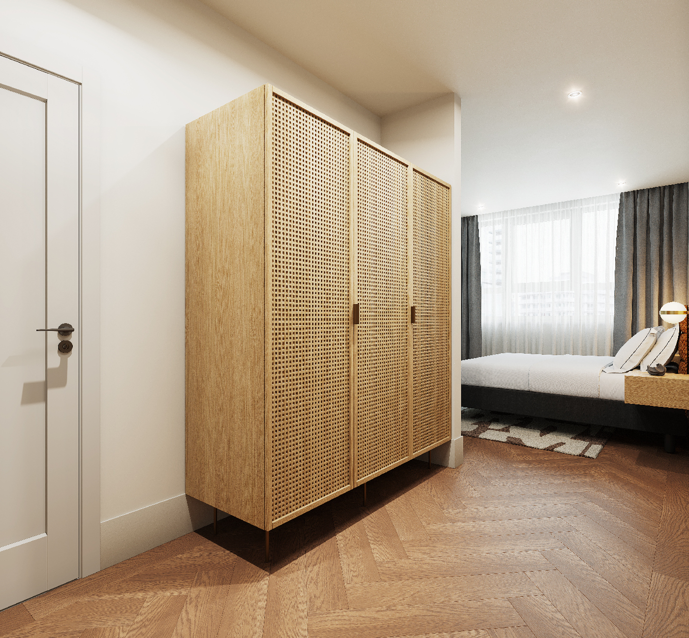 Large wardrobe with natural woven finish in the bedroom of the two bedroom apartment at master Wola Warsaw.