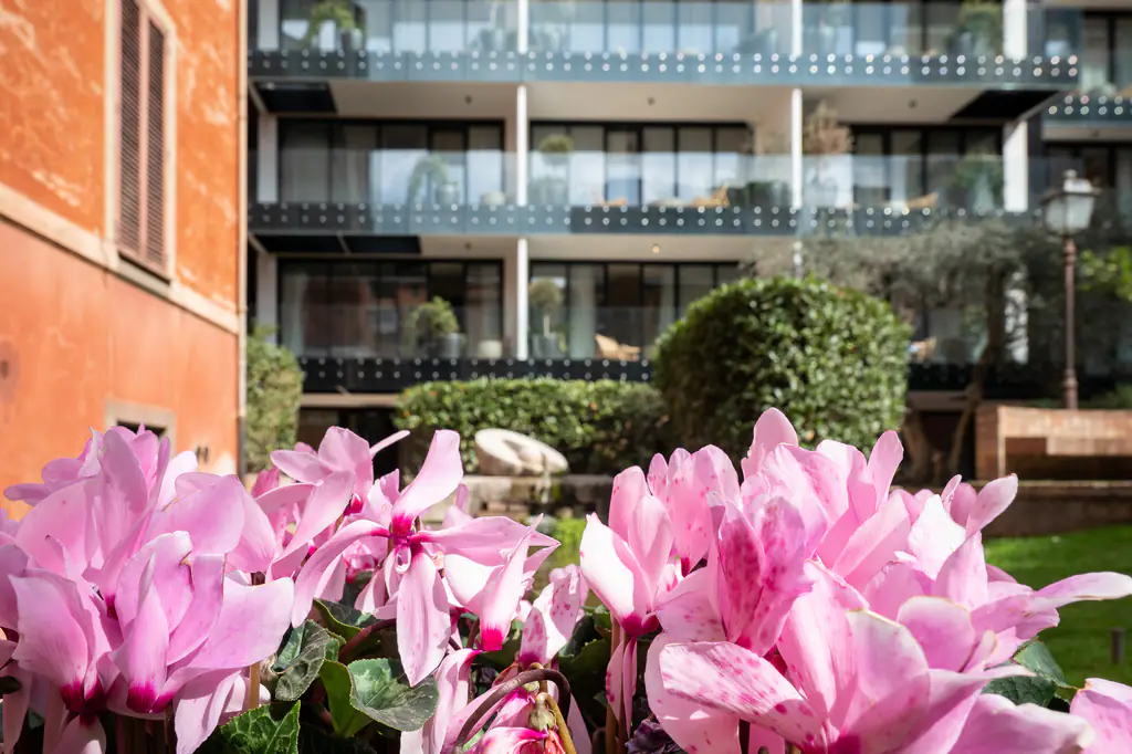 Facade of master Trevi Rome Aparthotel with elegant balconies overlooking the historic streets of Rome